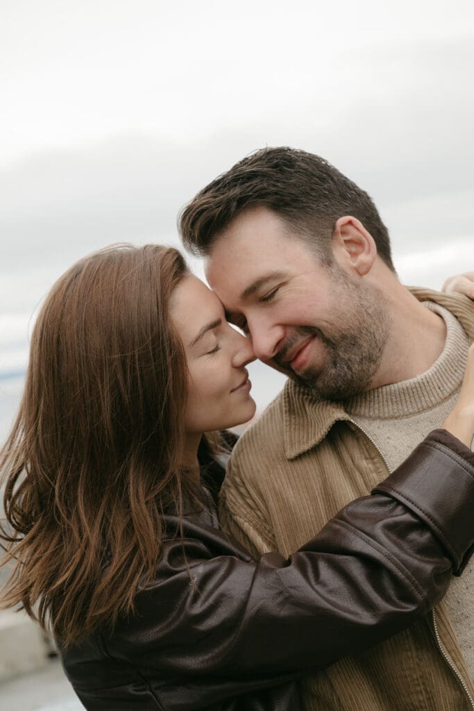 Man and woman embracing cheek to cheek