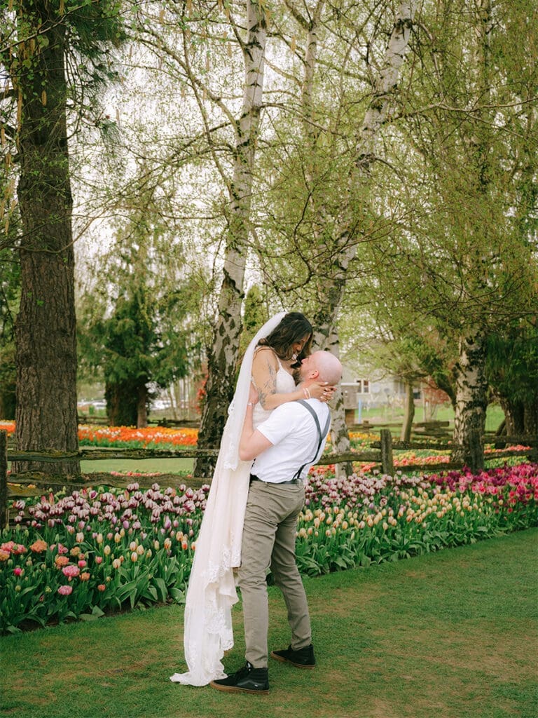 a couple in wedding attire in the Skagit Valley Tulip Field gardens