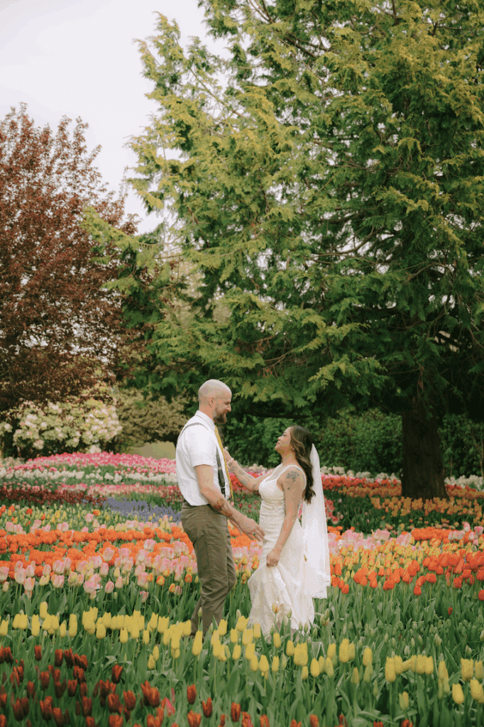a couple in wedding attire in the Skagit Valley Tulip Field gardens